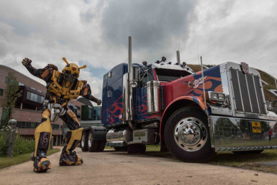 Transformers Optimus Prime and Bumblebee ride in to help children build robots at Alder Hey Children’s Hospital