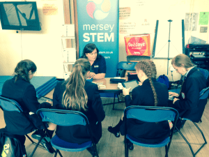 Angela discussing STEM opportunities with the young people of Deyes High School